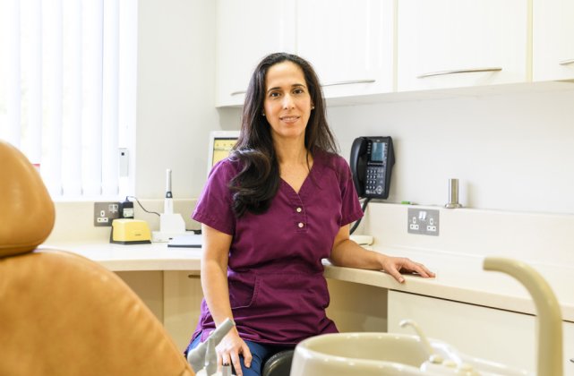 Dr Maria Rodrigues and assistant working at the Dental Implant Clinic